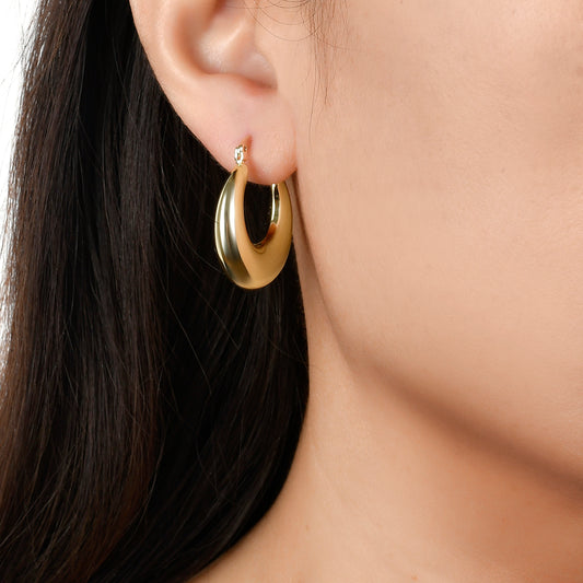 Model photo of chunky 18K gold plated  hoop earrings